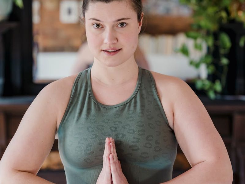 Person doing light relaxation exercises in a dark room